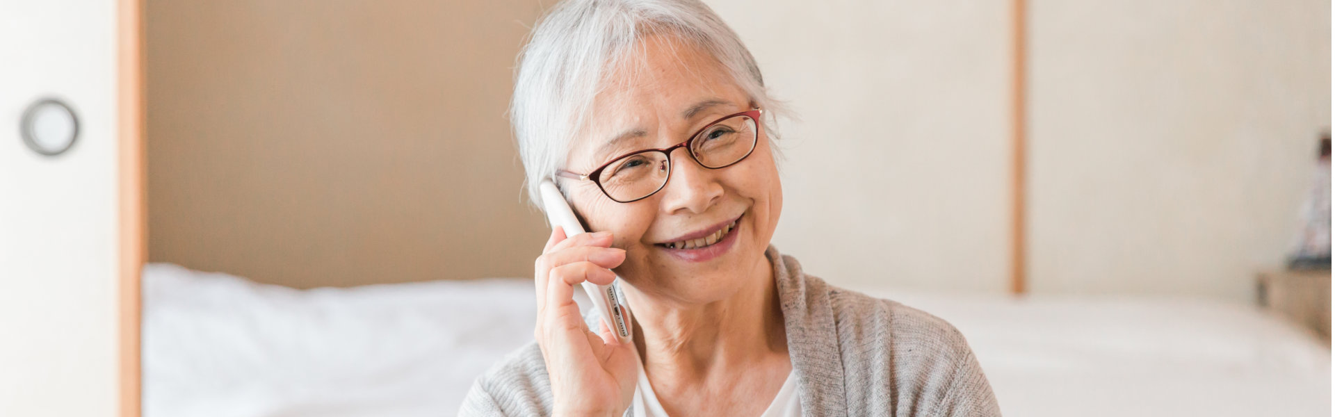 elderly woman talking on the phone